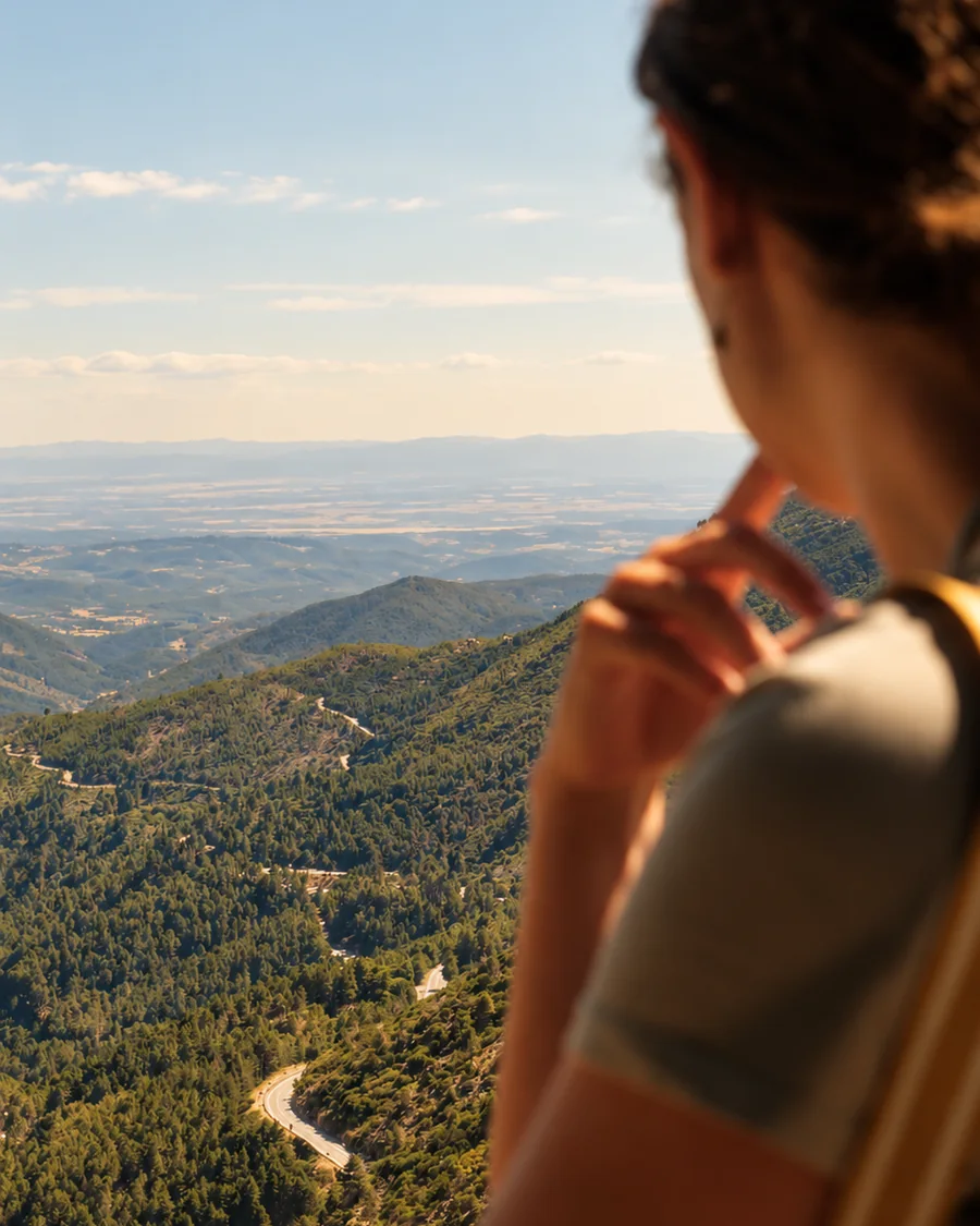 Mencía Barroso looking out over a mountain landscape